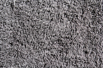 Close up textured background of grey plush material