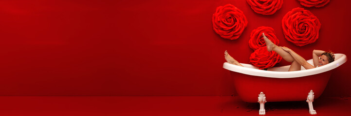 red bathtub in red bathroom. Valentine bath beautiful bath with rose. Romantic gift for Valentine's...