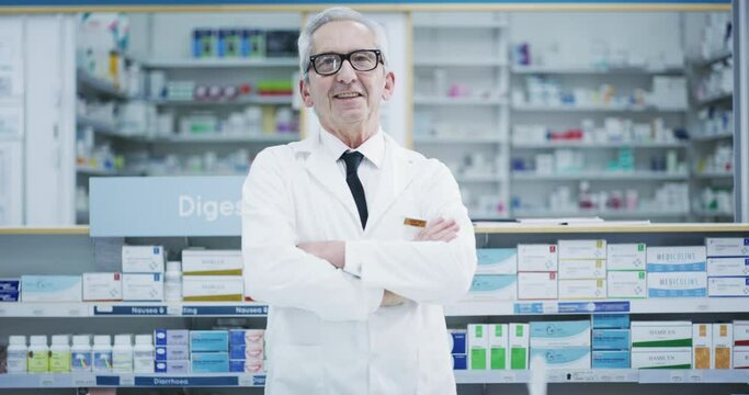 Doctor, pharmacist and success of a senior man in success at a pharmacy or drugstore. Portrait of a happy professional medical expert for pills, medicine and product prescription in healthcare store.