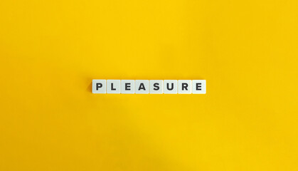Pleasure Word on Letter Tiles on Yellow Background. Minimal Aesthetics.