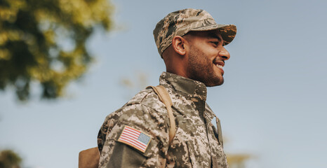 Happy young soldier returning home from the army - obrazy, fototapety, plakaty