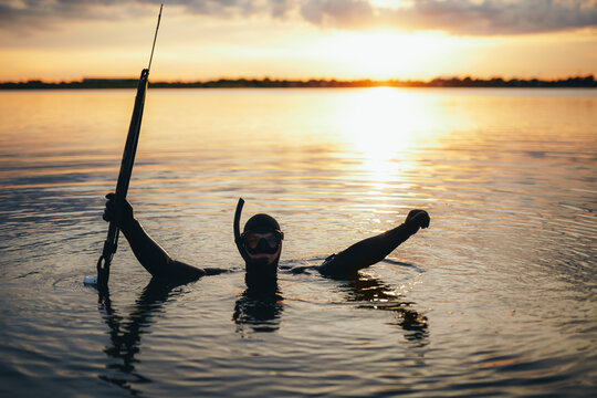 Enjoying spearfishing at sunset