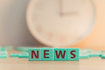 The word NEWS made of small colorful cubes with letters. . High quality photo