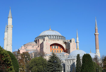 Fototapeta na wymiar Hagia Sophia aka Ayasofya with Trees and Blue sky in Istanbul, Turkey