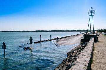 rising waters, sign on the beach, passage du Gois, Noirmoutier, France