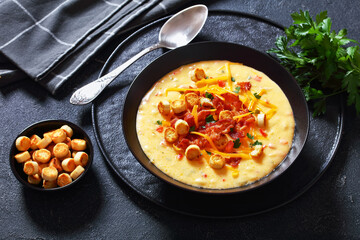 savory creamy pumpkin soup in bowl, top view