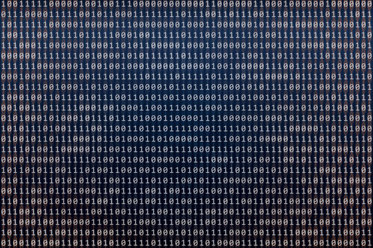 Binary code abstract texture, blur effect in one and zero orande data. Coding, cyber and security concept.