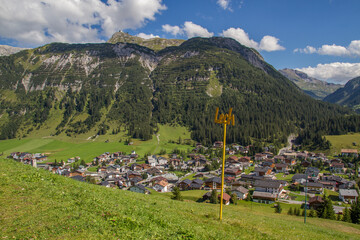 View of austrian village Lech am Arlberg at the European Alps with surrounding mountains, during summer