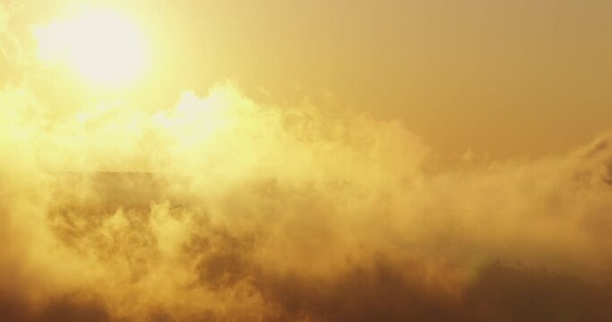 Sun, sky and clouds over horizon, 4k video of skyline view. Aerial nature landscape, sunrise in the mountain.