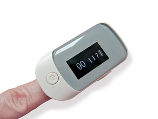 Finger with a pulse oximeter on a white background close-up. Display shows low saturation. Medicine, covid-19, symptoms, diagnostics, measuring instruments, oxygen saturation sensor