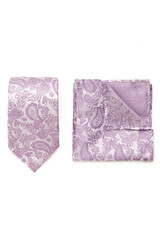 Close-up set of a purple and white tie and pocket square embossed with a floral paisley pattern. The paisley tie and pocket square are isolated on a white background. Top view.