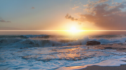 Dark dramatic sky with sunlight rays over the sea with lighthouse