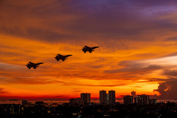 Fototapeta na wymiar Army Show performant of air craft in air show with twilight sky background. 