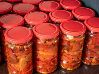 jars with preserved red peppers