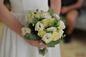 Bride in a dress with a wedding bouquet