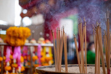 incense sticks in a buddhist temple - obrazy, fototapety, plakaty