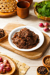 Beef Rendang is a Minang dish originating from the Minangkabau region in West Sumatra, Indonesia.  Rendang has been slow cooked and braised in a coconut milk seasoned with a herb and spice mixture