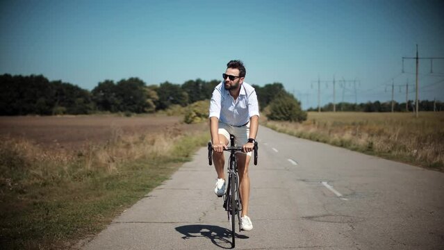 Happy Cyclist On Eco Transport. Modern Relaxed Guy Cycling Bike. Positive Man Inspiring Cycling. Tourist Cyclist Journey On Bicycle. Cyclist Hobby Travel Leisure. Sport Recreation Emotions Cycling