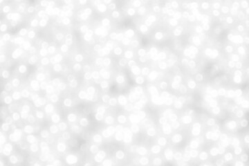 White and gray bokeh background. Photo can be used for the concepts of New Year, Christmas, Wedding Anniversary and all celebrations.