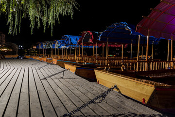 The historic pletna rowing boats of Bled at night