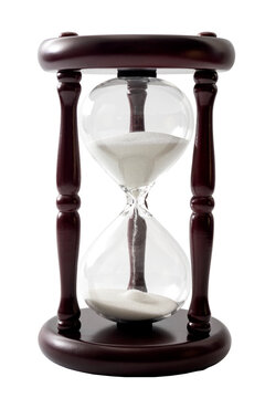 Sand flowing in transparent hourglass used to measure the passing of time, isolated on white background with clipping path cutout concept for countdown to deadline, antique clock and sense of urgency