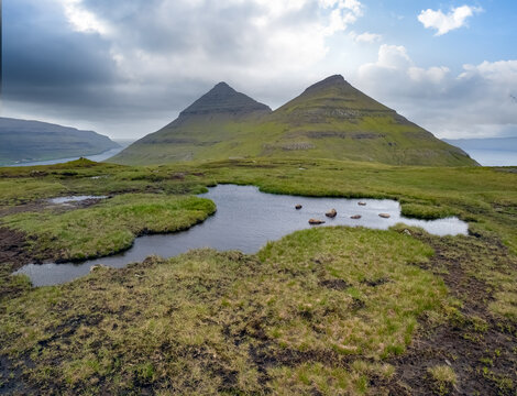 Hiking to the top of the Klakkur mountain near Klaksvík, the second largest town of the Faroes behind Tórshavn, located on Borðoy Island, Norðoyar, Faroe Islands