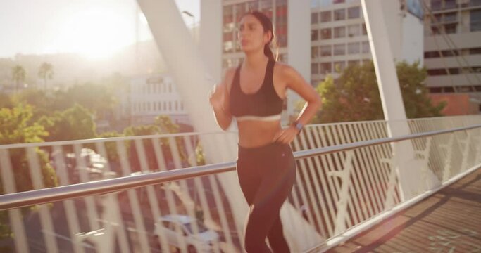 Fitness, runner and city bridge with woman running in sports exercise, healthy training or wellness workout outdoor in summer sun. Motivation, vision or goals for speed, body care and cardio strength