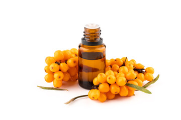Sea-buckthorn oil and berries on a white background.