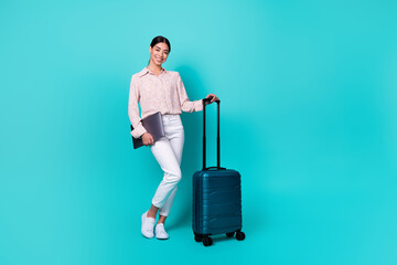 Full body photo of young japanese woman hold laptop business trip wear trendy smart casual look isolated on aquamarine color background