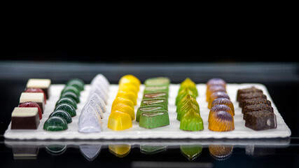 close up of chocolate candy on the white plate