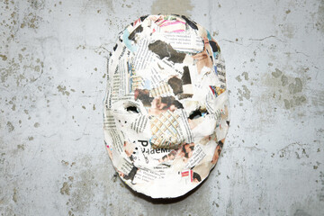 decorative, carnival face mask on the background of the texture of the old concrete wall