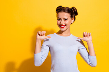Photo of young cute cheerful female pointing herself recommend her skills services isolated on yellow color background