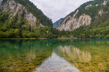 Naklejka na ściany i meble Horizontal image with copy space for text of turquoise aters of Five-Color Pond lake in Jiuzhaigou Scenic area, Aba Tibetan Autonomous region, Sichuan, China, background