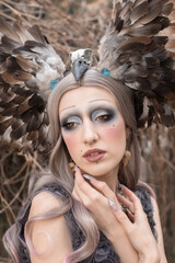 Mysterious female portrait. Beautiful model woman face closeup
