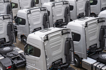 New heavy trucks in truck store, trucks lined up, truck market