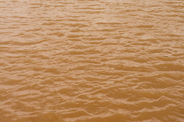 Background lake surface ferrous brown water from coal mining pit water eternity burdens