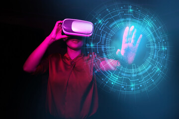 Futuristic digital technology, metaverse, NFT, virtual reality concept, young indian or asian girl wearing VR, virtual reality goggle, experiencing virtual world. Touch holographic effect. Neon