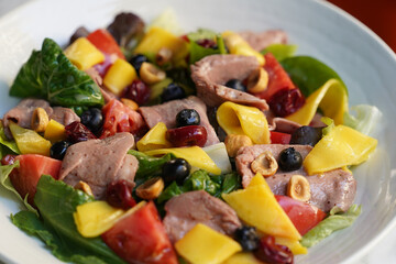 Antipasto salad with fresh meat, cheese and vegetables