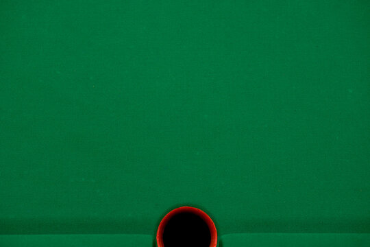Background billiard table in detail with hole on one bank green and red