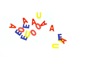 Multicolored vowels on white background