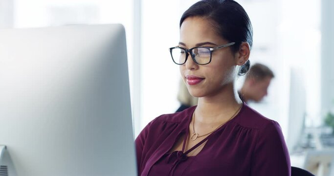 Business woman or employee typing on computer while reading fake news, research and misinformation online. Secretary on internet to communicate and schedule appointment in a corporate work office