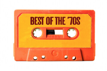An old vintage orange cassette tape for easy storage of music and audio, isolated, with text on the label: best of the 70s.
