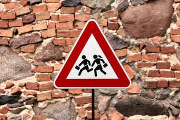 caution children crossing Road sign post mounted