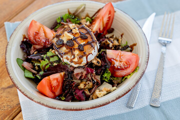 Salad with goat cheese and tomato  