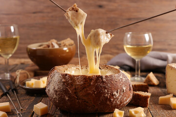 Traditional Swiss cheese fondue with wine glasses
