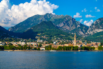 The city of Lecco, with its lakefront and its buildings, photographed in the evening.
 - obrazy, fototapety, plakaty