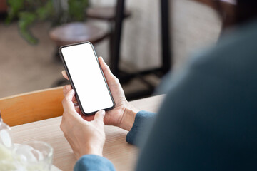 cell phone blank white screen mockup.hand holding texting using mobile on desk at office.background empty space for advertise.work people contact marketing business,technology