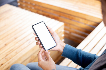 cell phone blank white screen mockup.hand holding texting using mobile on desk at office.background empty space for advertise.work people contact marketing business,technology