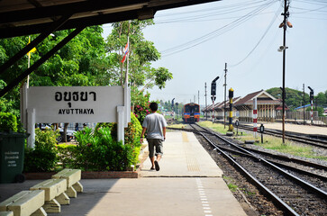 Track of railway in rural countryside for locomotive train running journey at Ayutthaya station on...