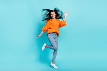 Fototapeta na wymiar Full body photo of charming sportive lady jumping have good mood isolated on teal color background